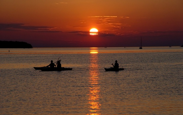 Beautiful sunset and the sailors