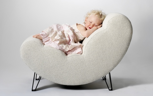 Cute Baby Girl Sleeping On The Chair