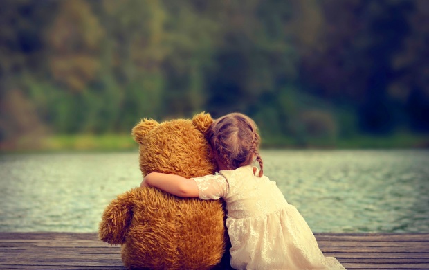 Cute Girl Hugging Teddy Bear