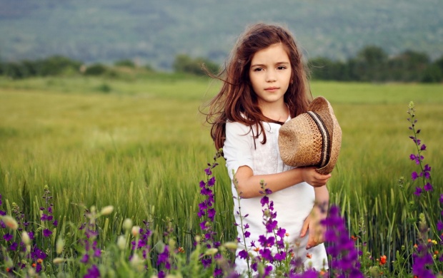 Cute Girl In Flowers Field