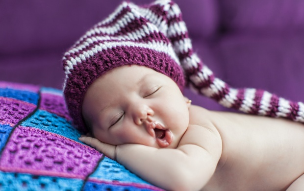 Cute Newborn Baby Sleeps In A Hat