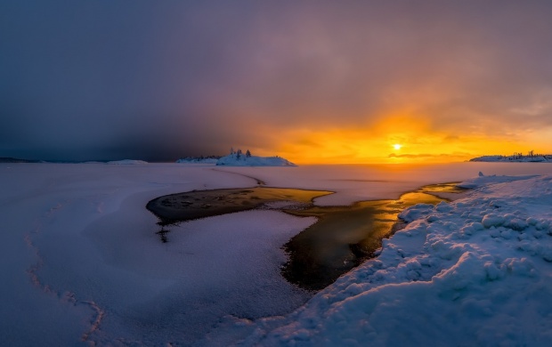 Dramatic Sunset Over Frozen Lake