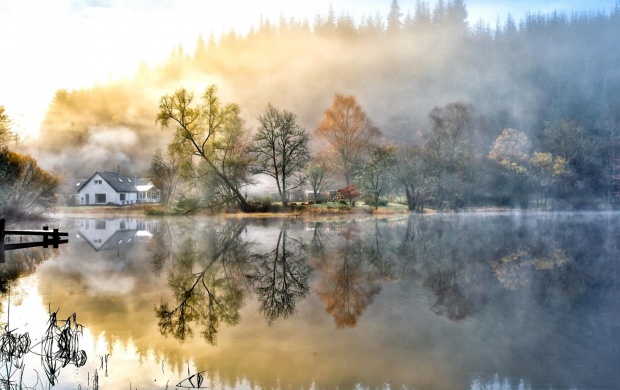 Foggy Landscape Mirrored into the Lake