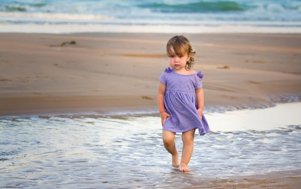 Girl With Purple Dress In The Sea