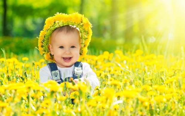 Happy Baby Girl With Yellow Flowers