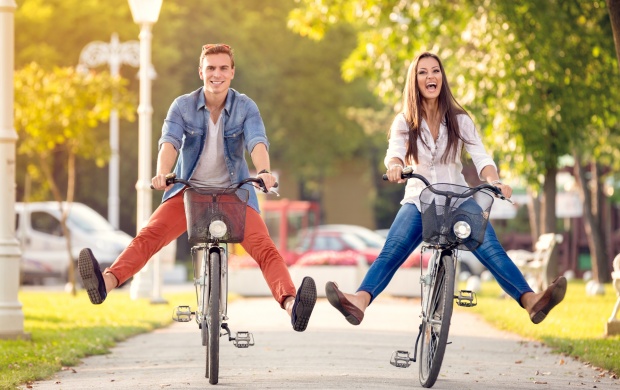 Happy Couple On Bikes