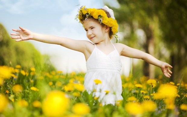 Little Girl With Flower In Field