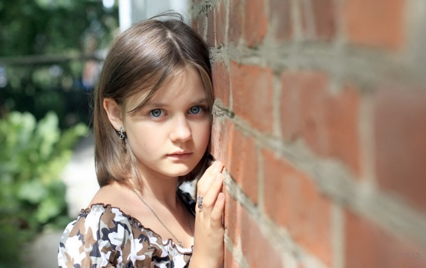 Sad Girl Near Brick Wall