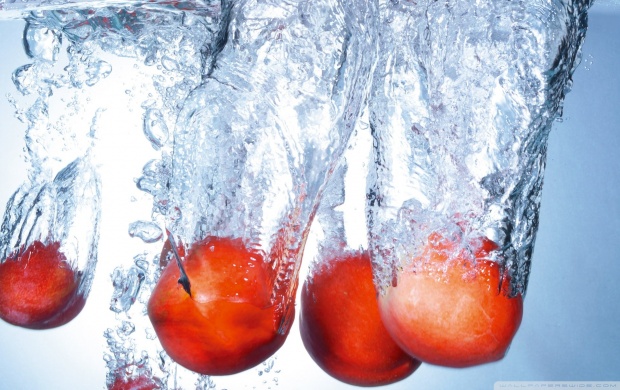 Water Splash By Red Apples