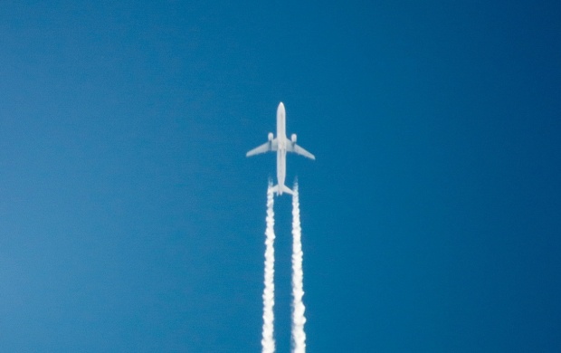 White Aircraft In The Blue Sky