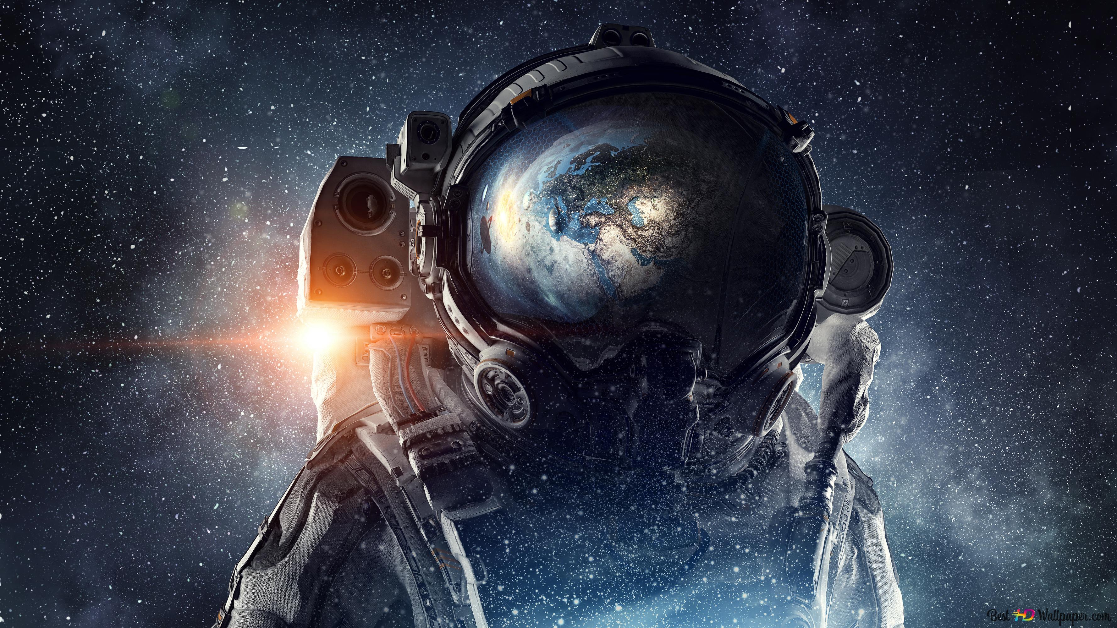 Astronaut with world silhouette reflected on his helmet k wallpaper download