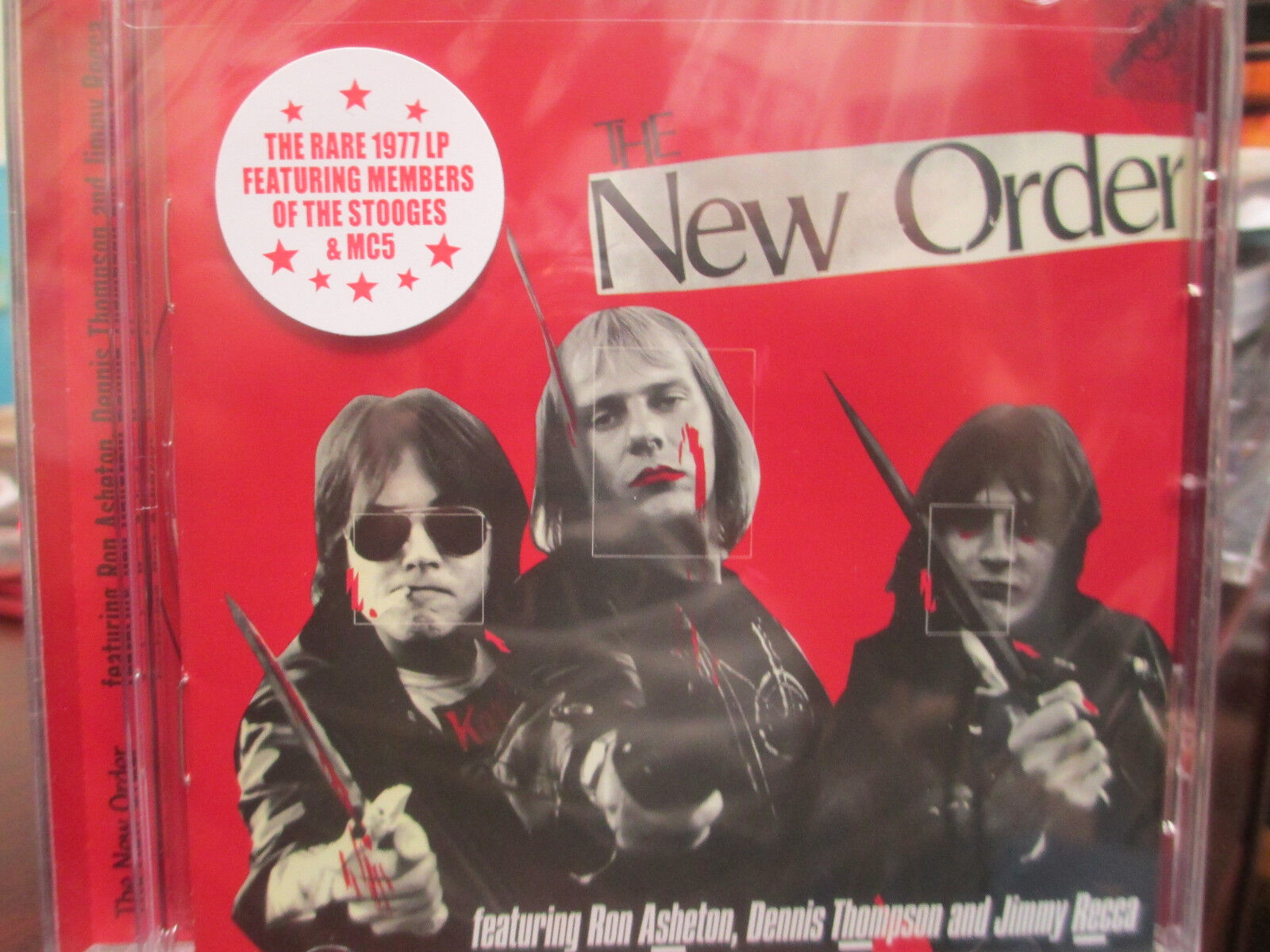 The new order cd featuring ron ashetondennis thompsonjimmy recca stoogesmc