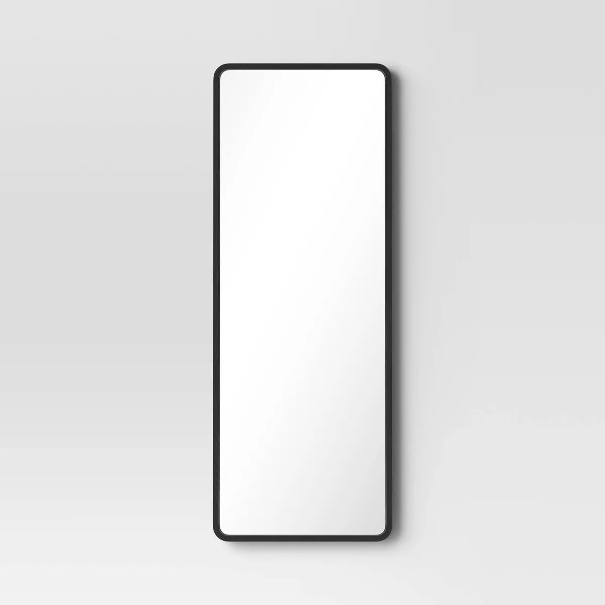 Rounded corner leaner mirror at