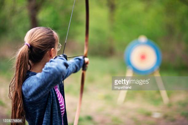 Arrow bow and arrow photos and premium high res pictures
