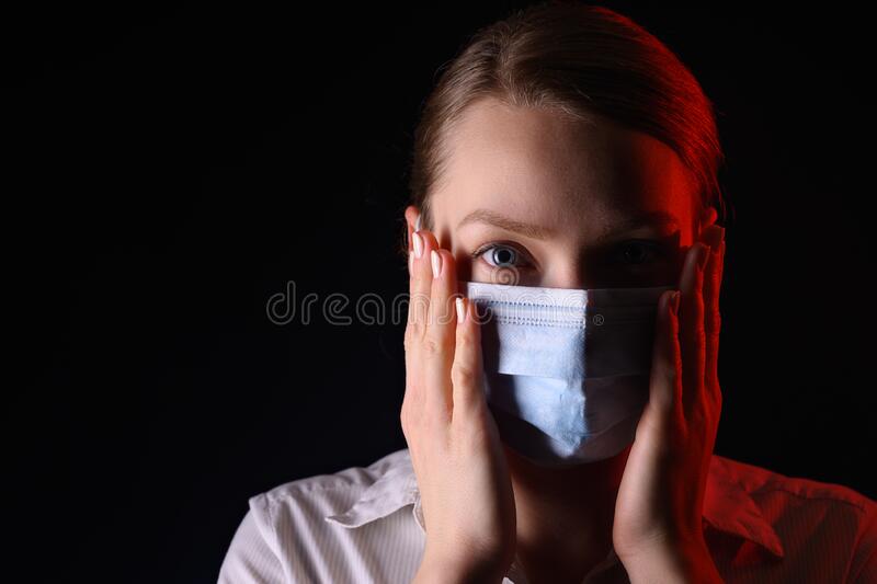 Coronavirus a girl in a mask on a black background title about the outbreak of the corona virus in china illness stock photo