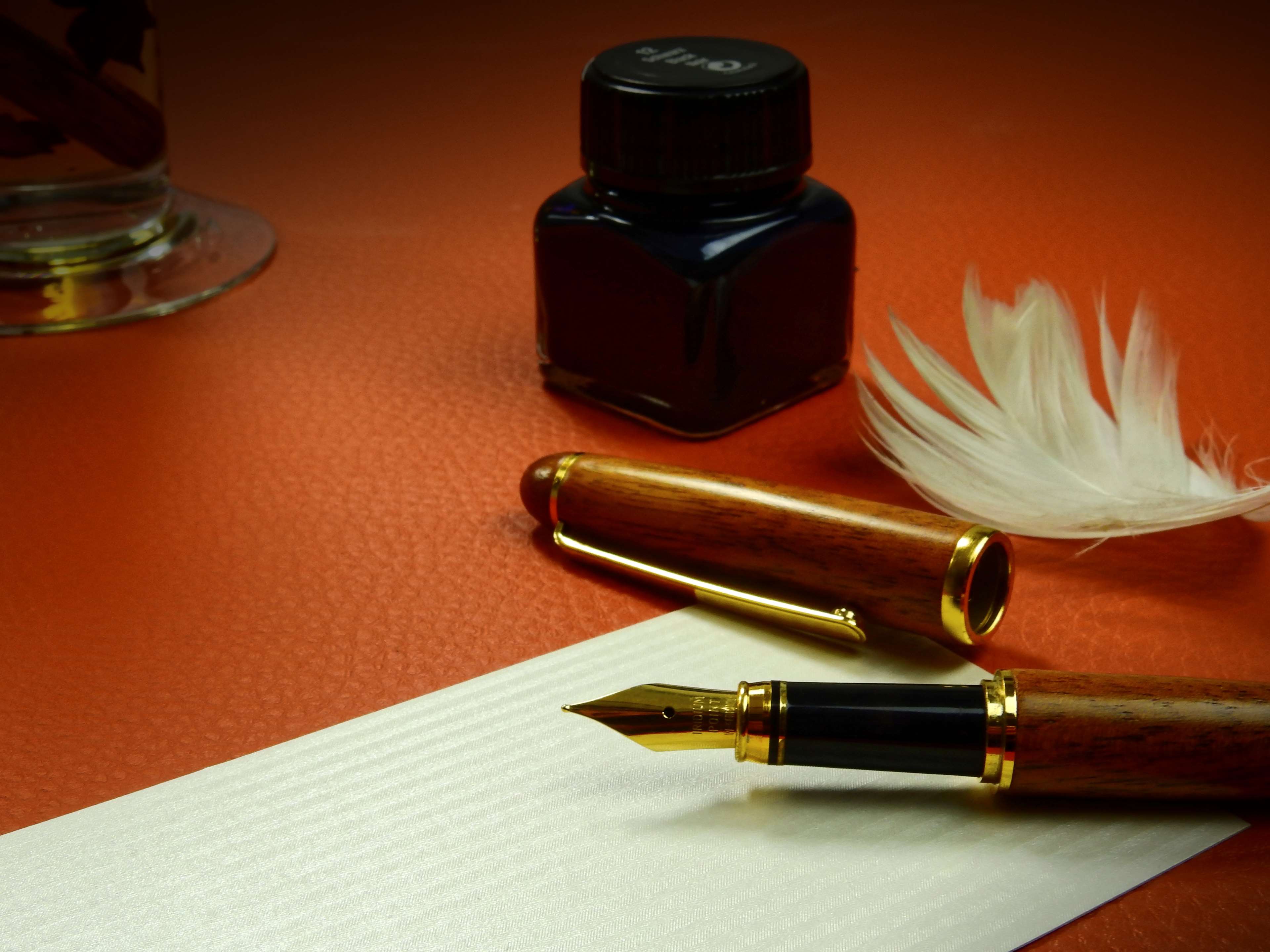 Close up position feather filler fountain pen ink letter office paper pen stationery still life table workspace writing writing tool k