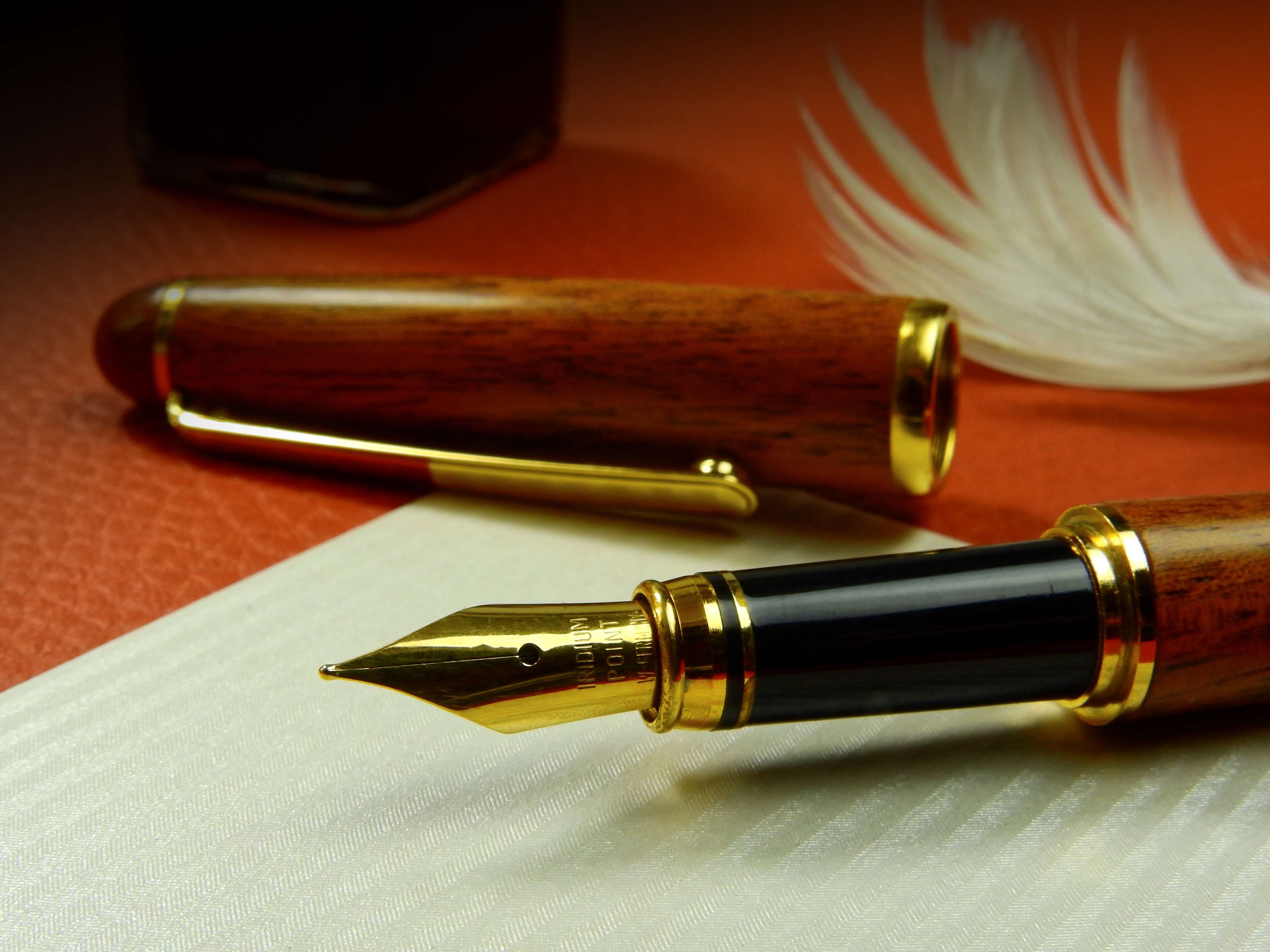 Close up position desk document feather fountain pen gold ink office paper pen pointed stationery writing writing tool k