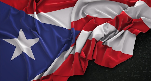 Free photo puerto rico flag wrinkled on dark background d render