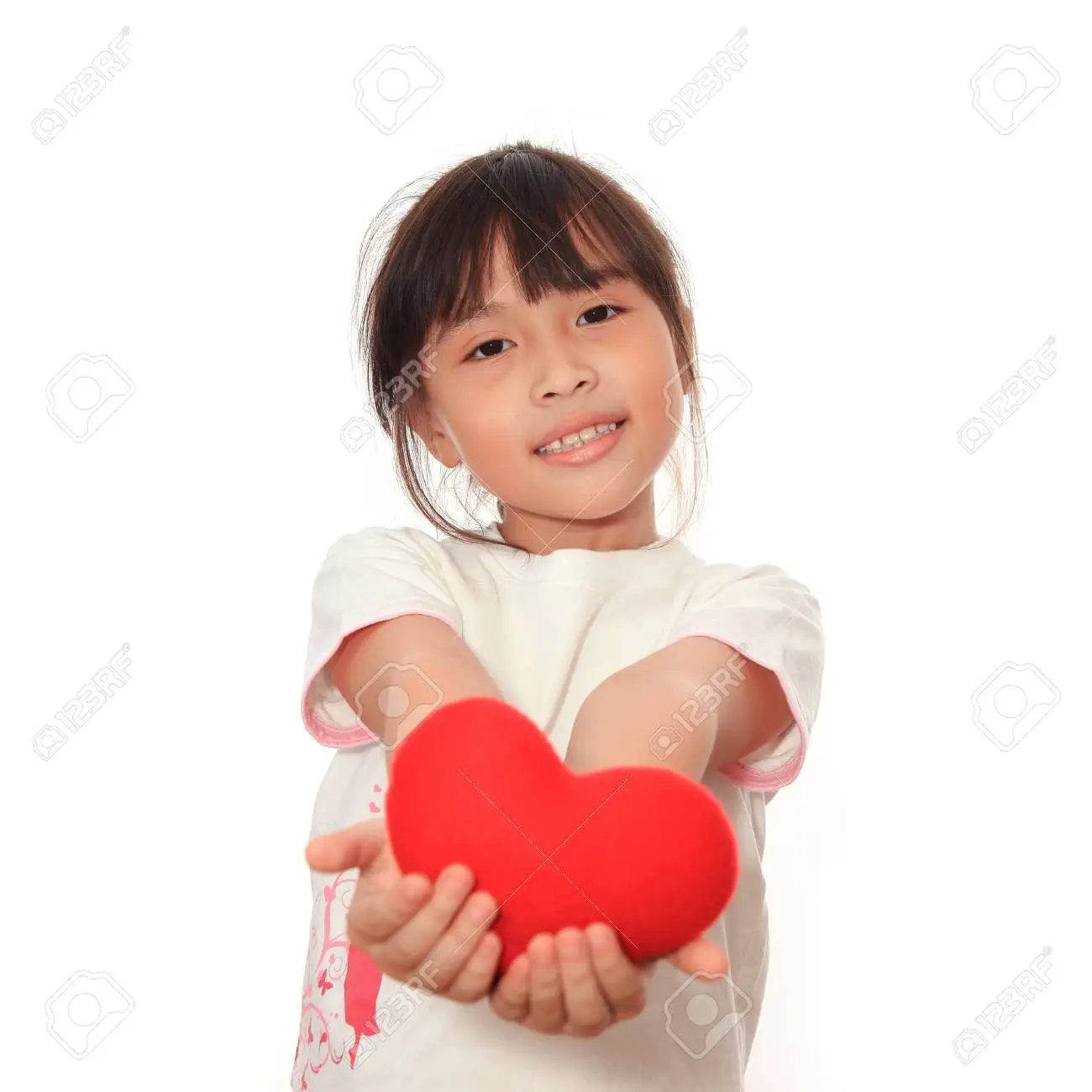 Asian cute girl giving symbol of red heart for you stock photo picture and royalty free image image