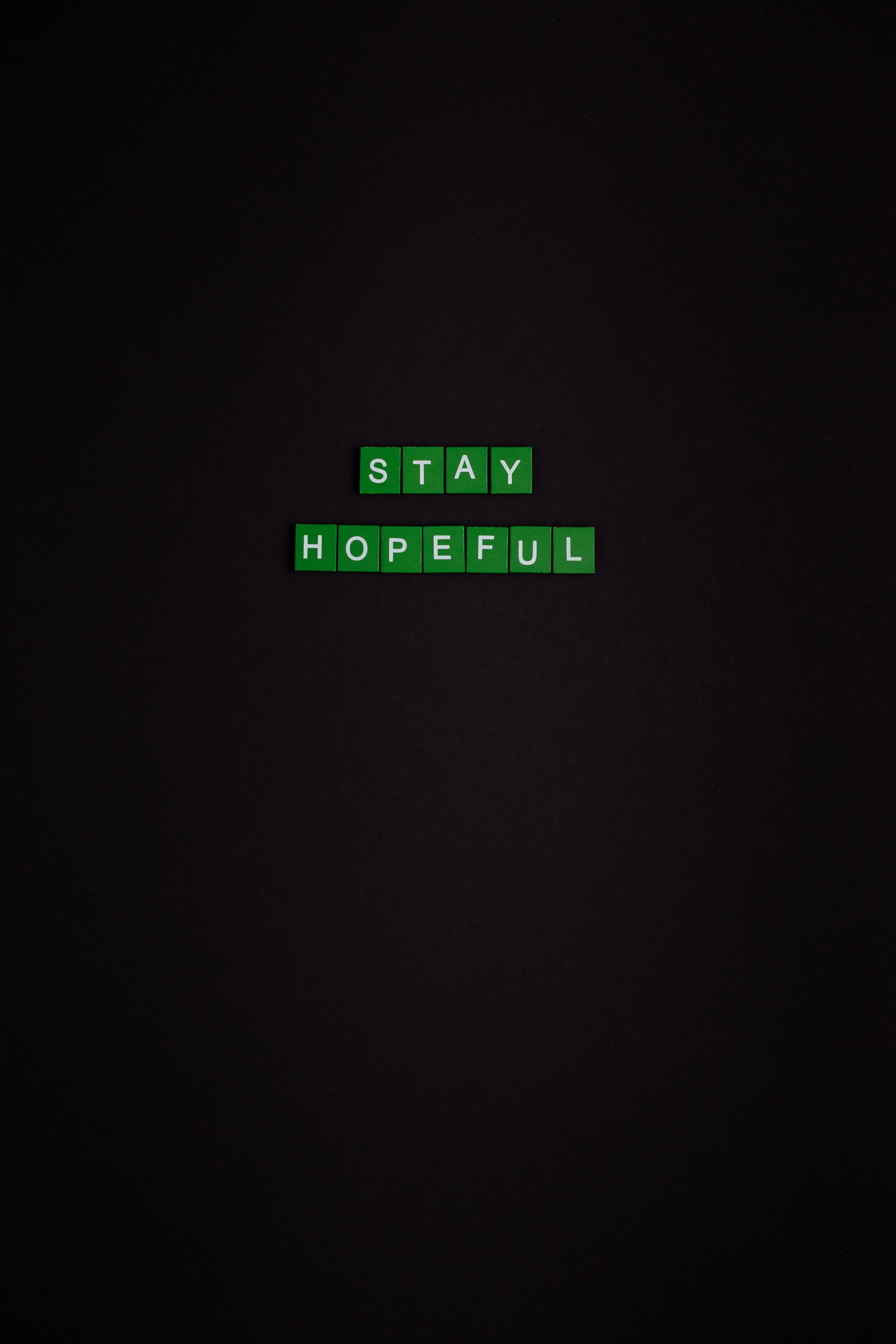 Stay hopeful text on black background