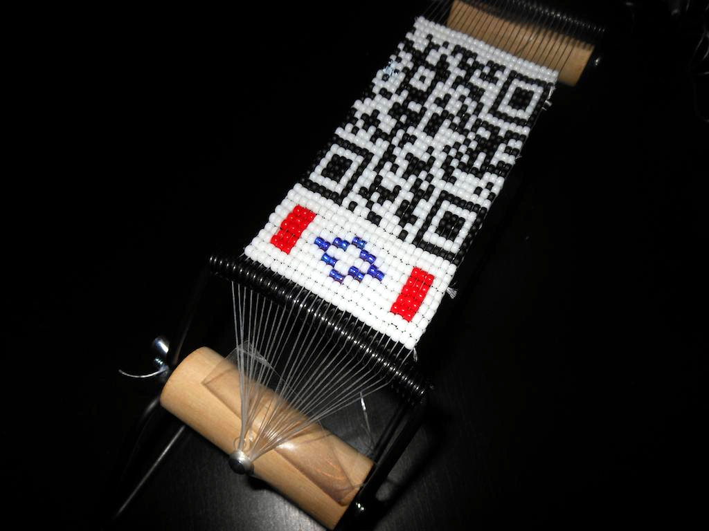 Beaded qr code bracelets weave a storytelling interface