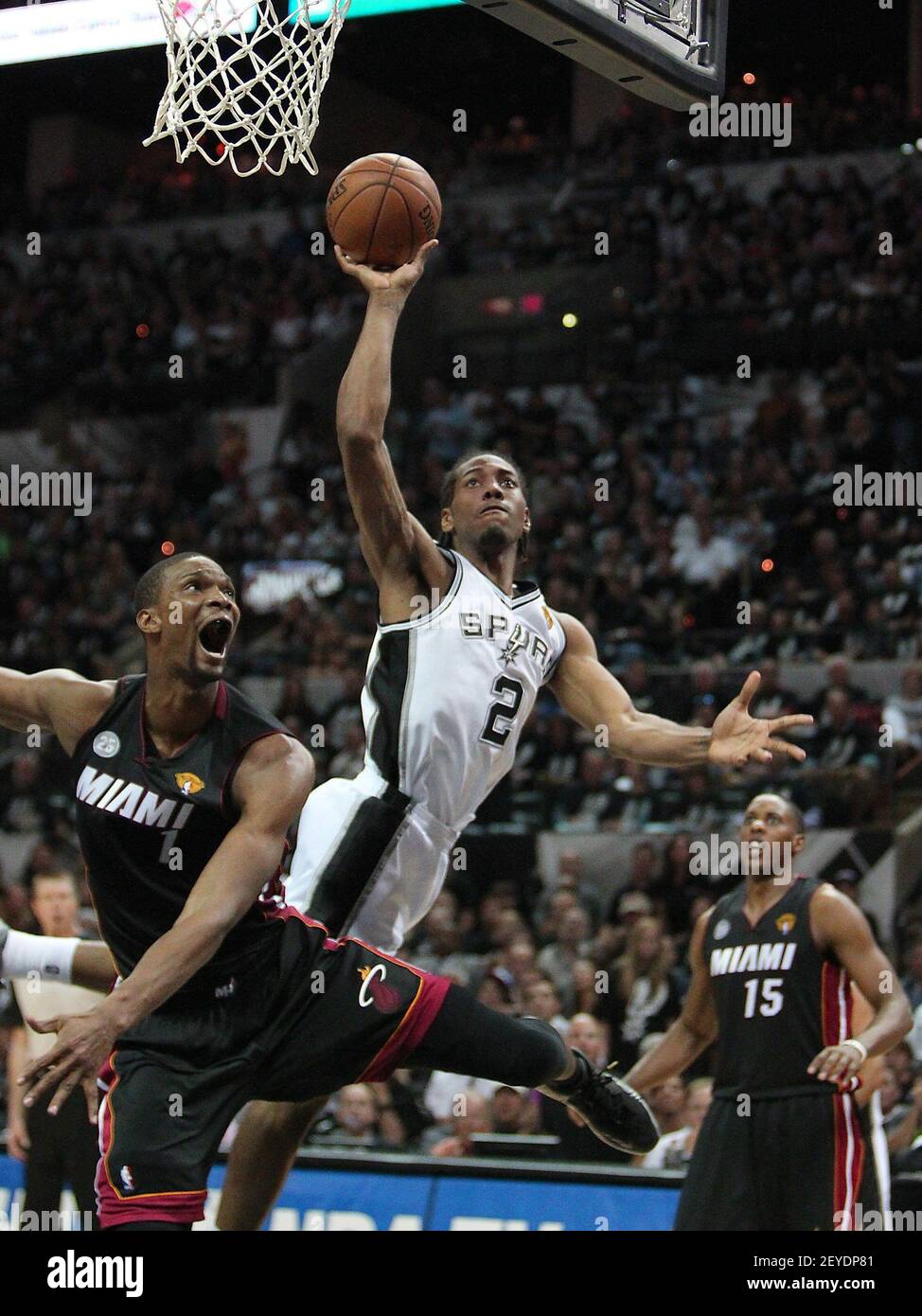 San antonio spurs kawhi leonard is fouled by miami heat forward chris bosh during the fourth quarter in game of the nba finals at the att center in san antonio texas