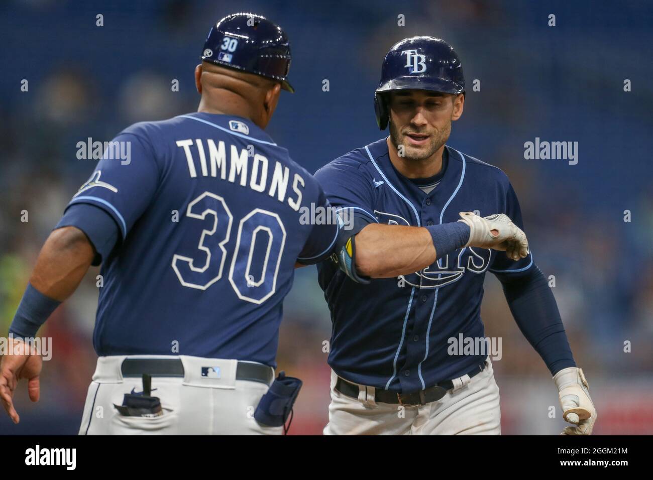 St petersburg fl usa tampa bay rays first base coach ozzie timmons elbow bumps center fielder kevin kiermaier after he singles in the b stock photo