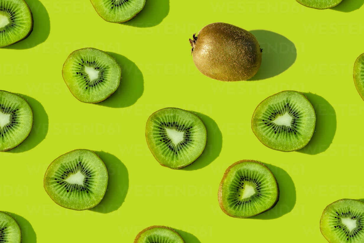 Kiwi fruit pattern on green background stock photo