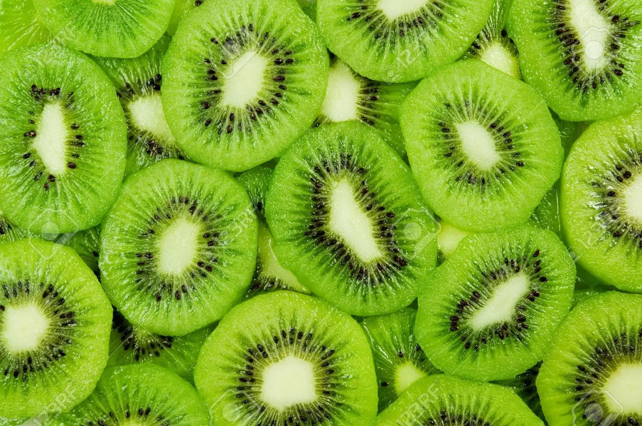 Fresh and ripe slices of kiwi fruit great summer wallpaper background stock photo picture and royalty free image image