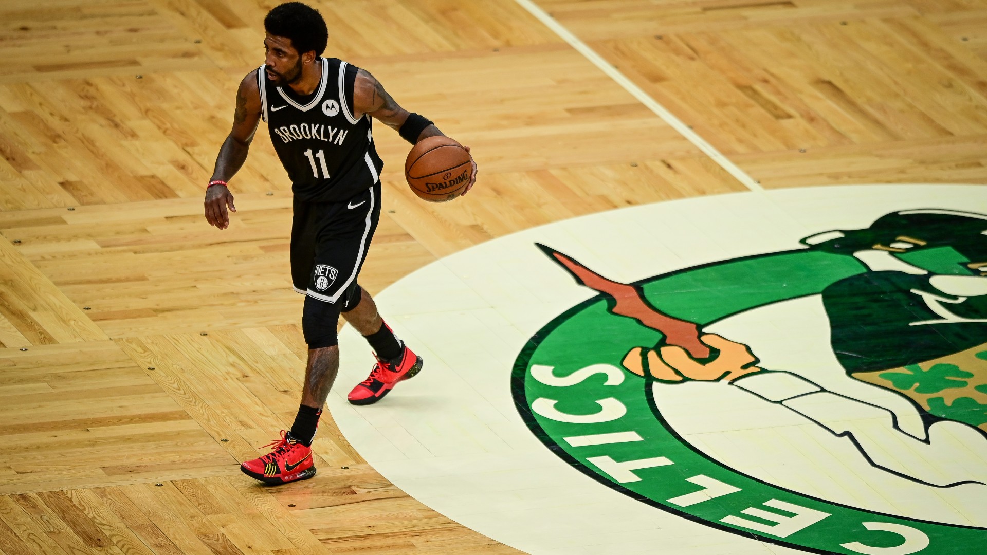 Video of kyrie irving stomping on celtics logo sparks nba twitter debate over classless act sporting news