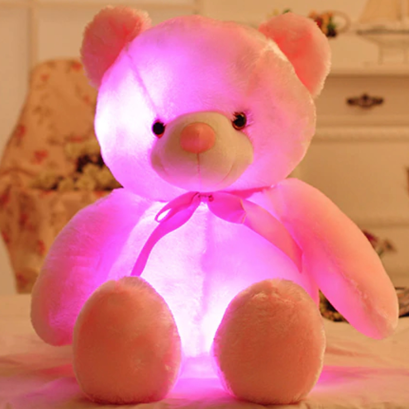 Pink light up teddy bear lights up different colours in his tummy
