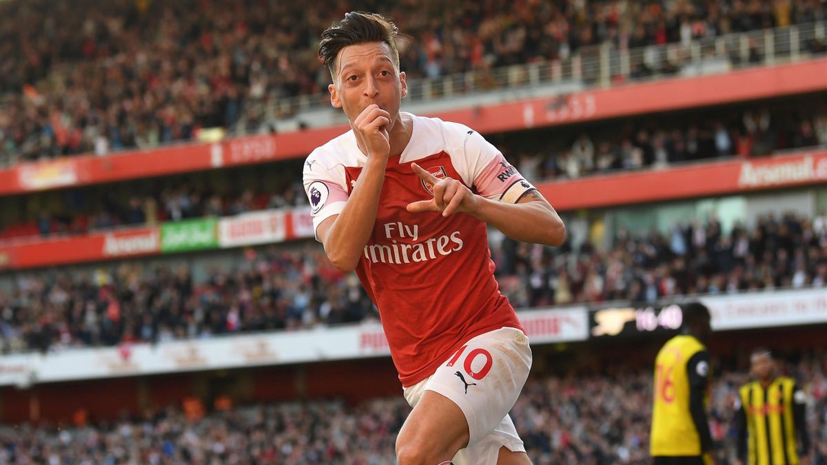 Mesut ozil makes tottenham trophy jibe when asked if he would join arsenals rivals