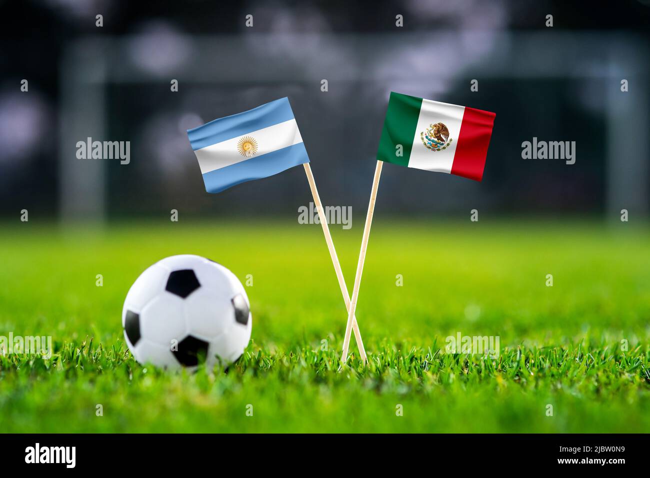 Argentina vs mexico lusail football match wallpaper handmade national flags and soccer ball on green grass football stadium in background black stock photo