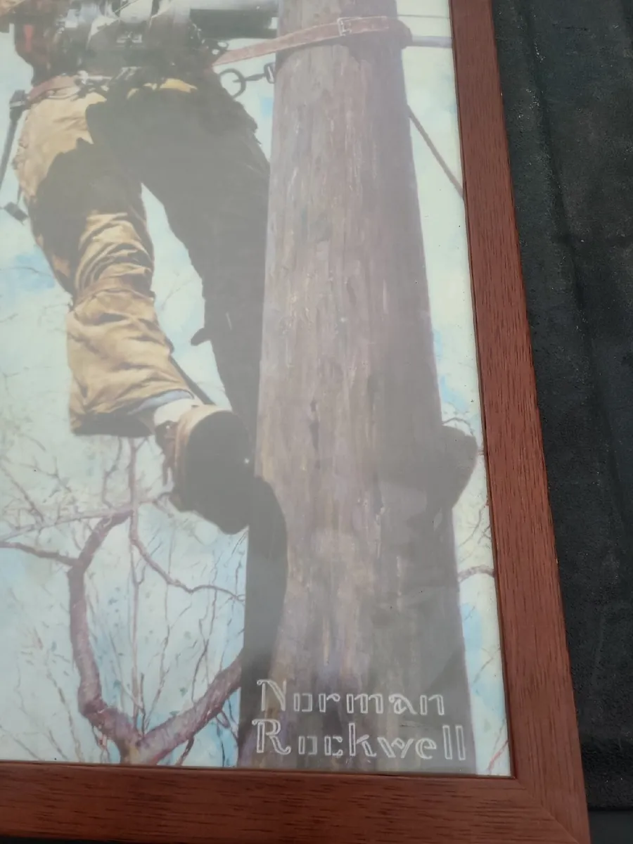 Norman rockwell pic of lineman on pole framed