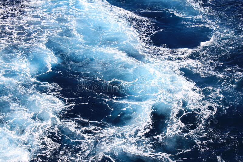 Ocean waves wallpaper dark blue water and sea foam from aerial view stock image