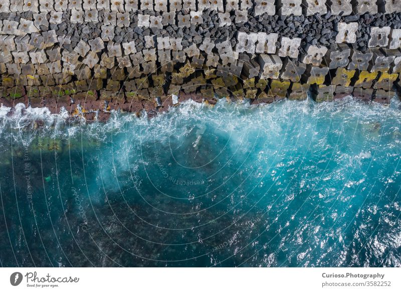 Aerial view to ocean waves blue water background photo made from above by drone