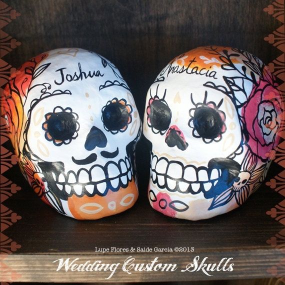 Hand made custom paper mache skulls day of the dead wedding cake toppers by black willow gallery