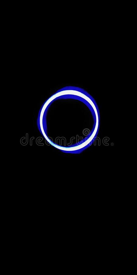 Blue ring light with black background stock image