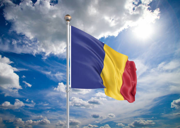 Realistic flag d illustration colored waving flag of romania on sunny blue sky background stock photo