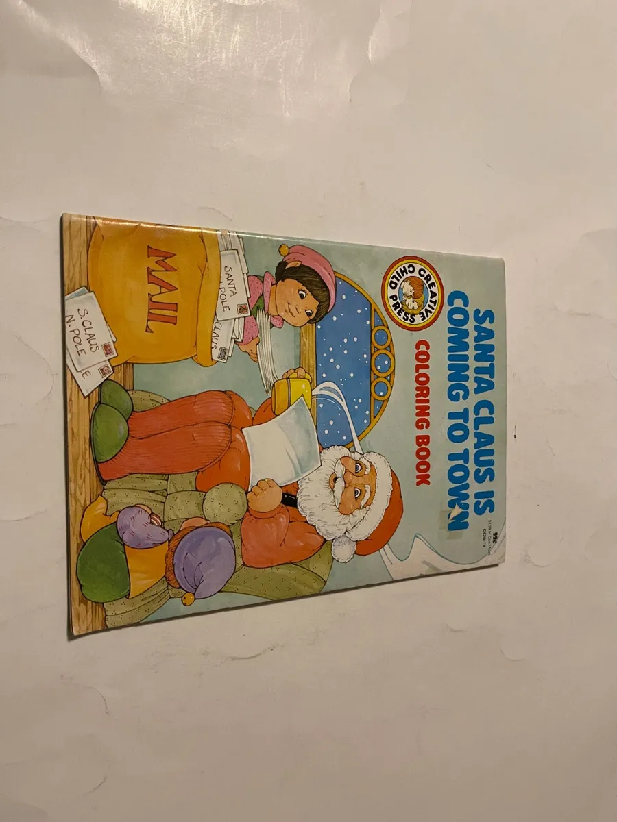Vintage santa claus is ing to town coloring book unused