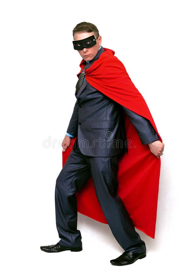Superhero in red cape and mask stock image