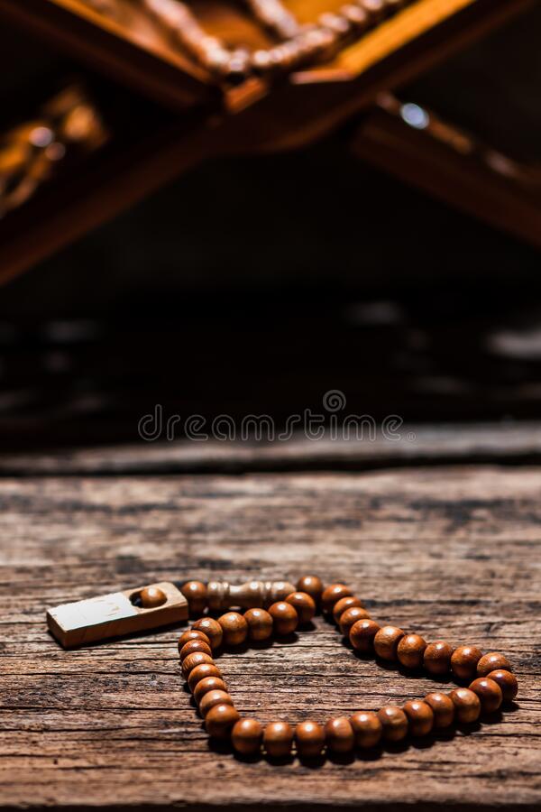 Tasbih or islamic prayer beads on rustic wooden surface stock image