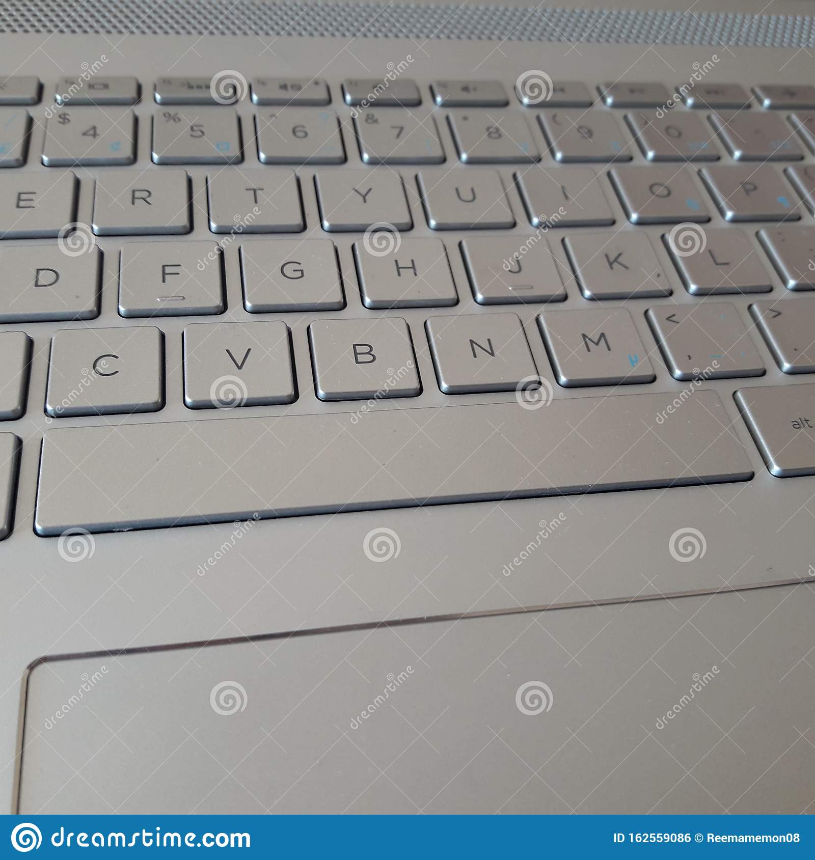 Laptop keyboard backgroundwallpaper sliver color stock photo