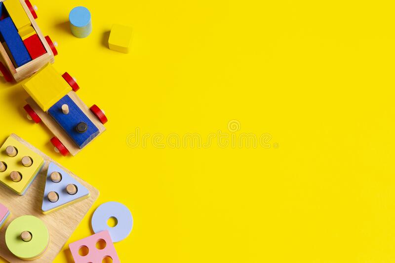 Baby kids toys background wooden train educational stacking color recognition puzzle toy and colorful blocks on yellow stock image