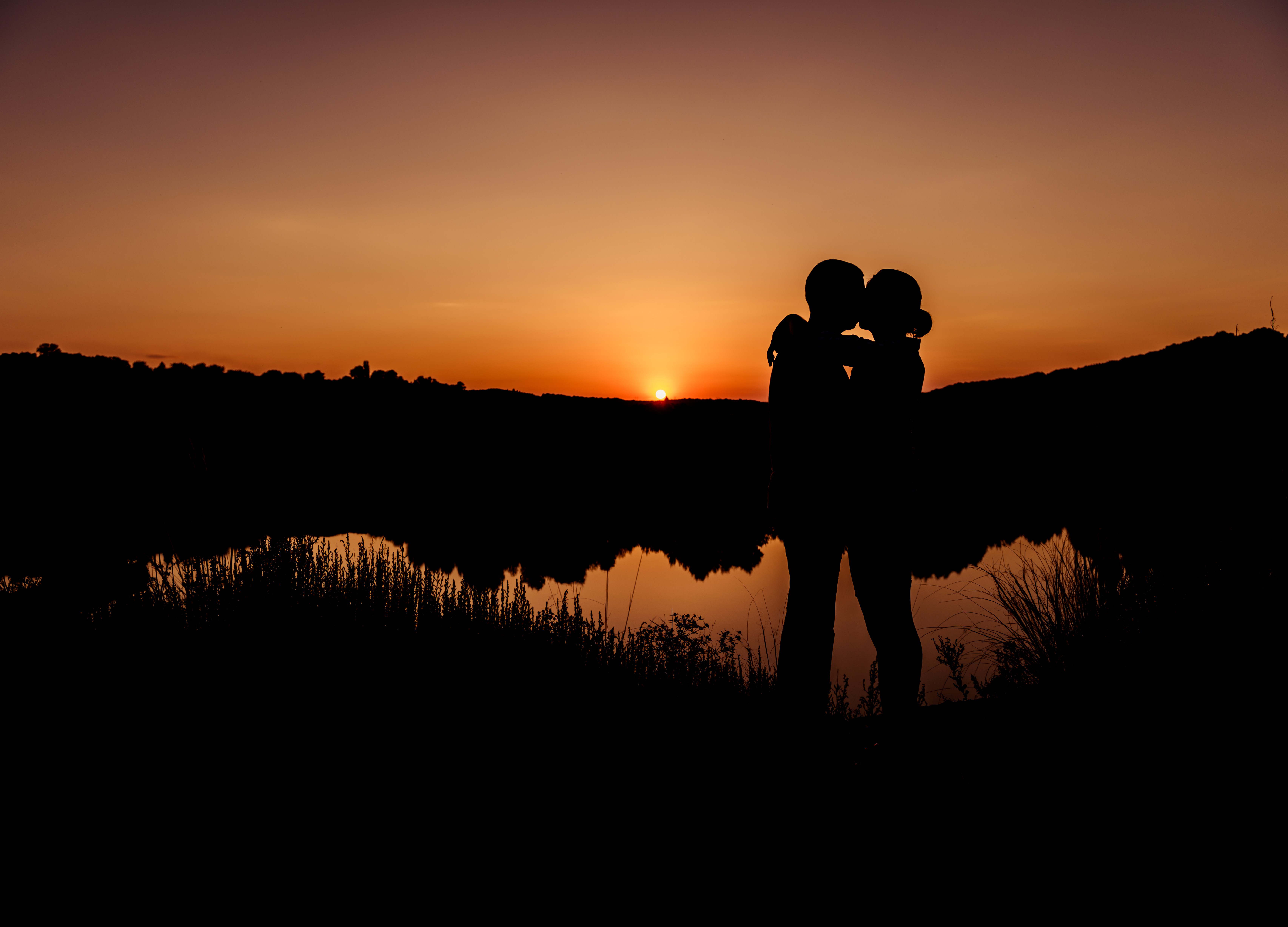 Couple sunset k romantic kiss