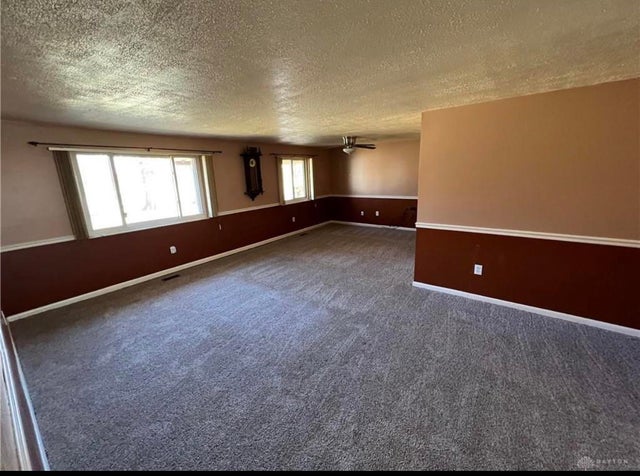 Painting new houseâkeep or lose the chair rail in large livingdining room in dining area under fan would wallpaper be a good accent to define the space and create interestlayer or a