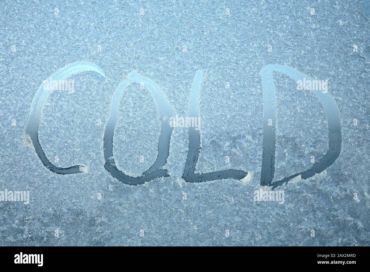 The inscription on frozen window pane words written on blurry translucent background stock photo with empty space for text for web print background and wallpaper stock photo