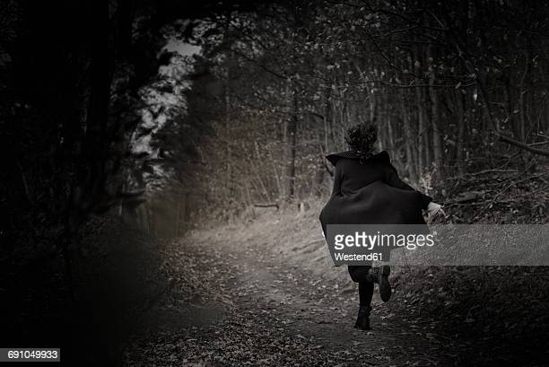 Woman running away photos and premium high res pictures