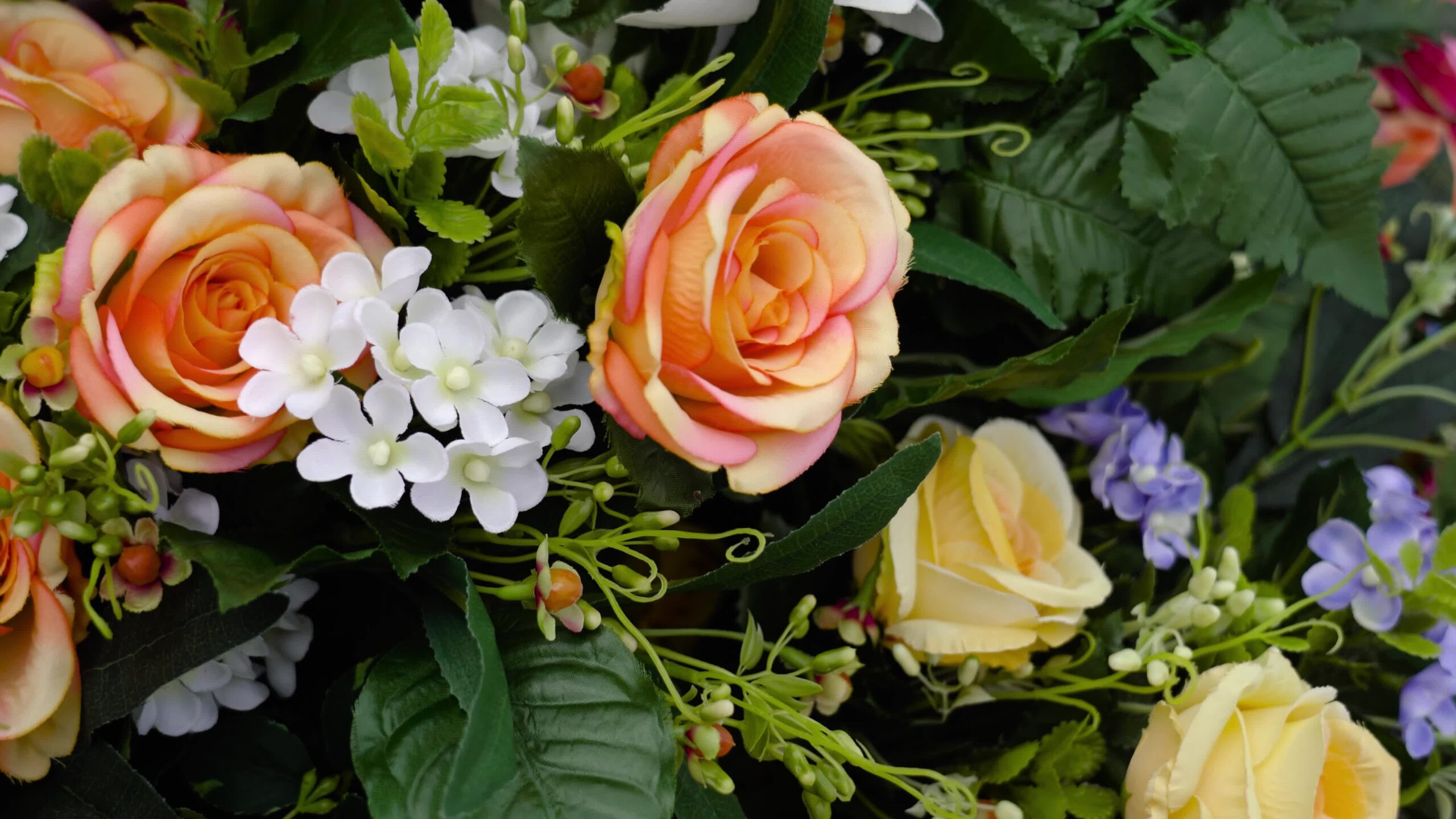 Hybrid tea roses among flowers in local florist marketplace