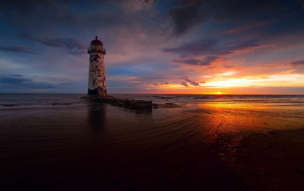 Beach Lighthouse At Sunset